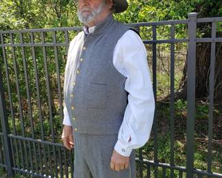 Under the frock coat, sash, and saber belt