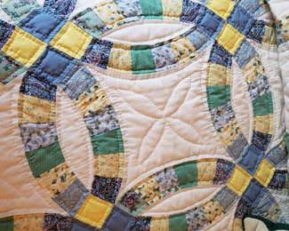 This 'double wedding ring' quilt is hand stitched
