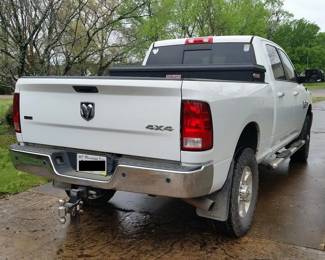 The truck has a factory-installed hideaway fifth wheel system. Also included are a tool box and the hitch pictured here.