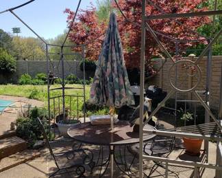Round wrought iron patio table and two wrought iron chairs. Wrought iron gazebo has new canopy still in the bag.