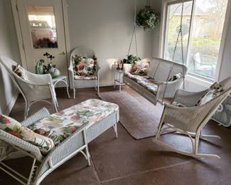 The sunroom is full of LLoyd Flanders wicker furniture