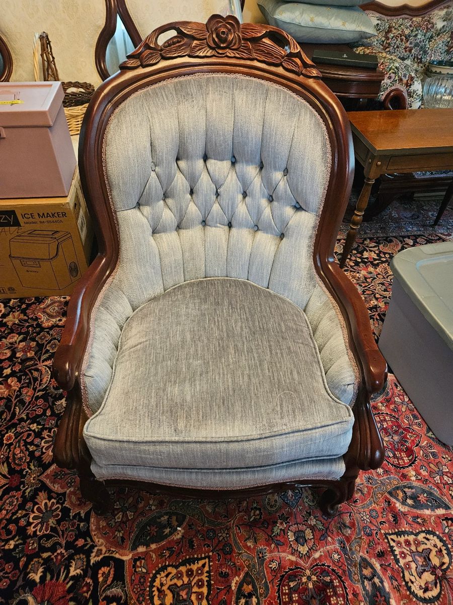 Blue Velvet Upholstered chair with carved wooden details