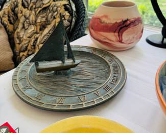 Vintage Brass Sundial with Sailboat & Waves over water