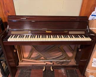 The Eavestaff Pianette Minipiano (it does have a front piece) This an excellent Piano for a player with limited space. (not SO HARD to move this one)