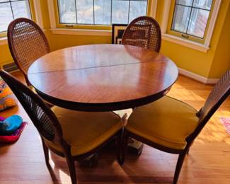 Vintage dining table and four golden velvet rattan woven chairs in pristine condition