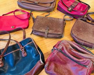 Vintage leather Coach handbags, worn in perfectly
