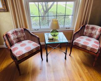 Another pristine vintage furniture example, a pair of French Regency style mid century bamboo cane barrel back armchairs.