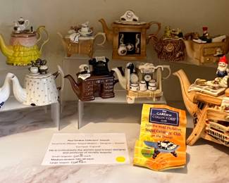 Paul Cadew teapot collection. 11 mini teat pots and 1 large teapot