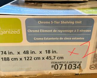 2 unopened boxes of chrome 5 tier shelves