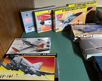 In the basement, there’s a massive ping-pong table (that stays with the house) but on it are fantastic, vintage airplane and car models mint in their original boxes!