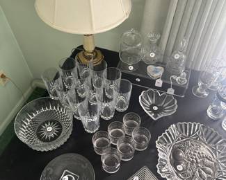 This is a table full of crystal, cut crystal and vintage glass