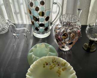 At the bottom center is a piece of Fenton custard glass. Just above it is another Fenton custard bowl, and at the top is a terrific polkadot, mid-century modern pitcher!