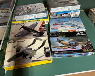 In the basement, there’s a massive ping-pong table (that stays with the house) but on it are fantastic, vintage airplane and car models mint in their original boxes!