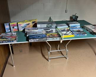 In the basement, there’s a massive ping-pong table (that stays with the house) but on it are fantastic, vintage airplane and car models mint in their original boxes!