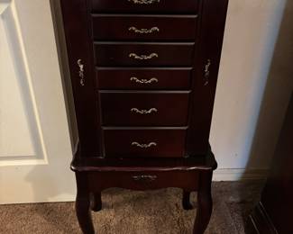 Jewelry Chest, 7 drawers, 2 side doors & lift mirror. 17”w 12”d 38.5”t. $ 120.00