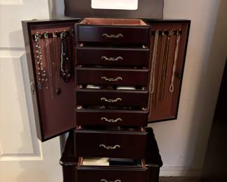 Jewelry Chest, 7 drawers, 2 side doors & lift mirror. 17”w 12”d 38.5”t. $ 120.00