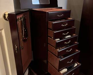 Jewelry Chest, 7 drawers, 2 side doors & lift mirror. 17”w 12”d 38.5”t. $ 120.00