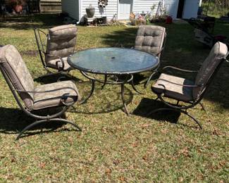 5 piece Patio Set metal table & chairs. Great glass top design. $150.00
