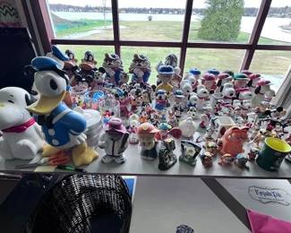 More figurines and cookie jars. Several Disney, Winnie the Pooh and themed items