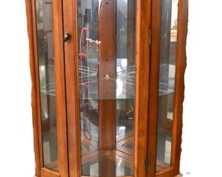 Petite corner cabinet with lighted interior and glass doors. Perfect for your collections!