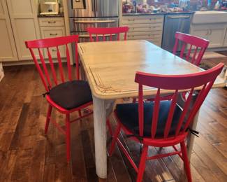 Antique table w four red chairs by Crate and Barrel