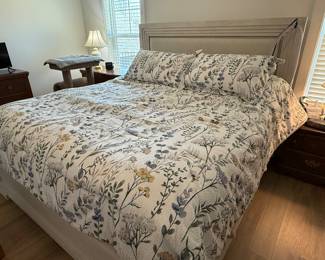 King sized bed with mattress and box springs. Bed is less than 1 year old 
