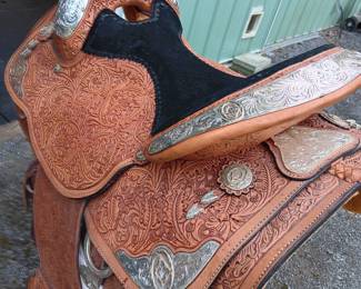 Handmade saddle made by Circle Y of Yoakum, Inc in Yoakum, Texas with silver-tone detail, 17" seat