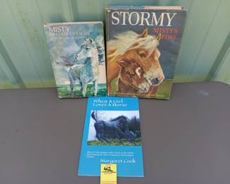 Lot #42: lot of 3 books including "Misty of Chincoteague" 1947, "Stormy Misty's Foal" 1963, and "When a Girl Loves a Horse" 2020