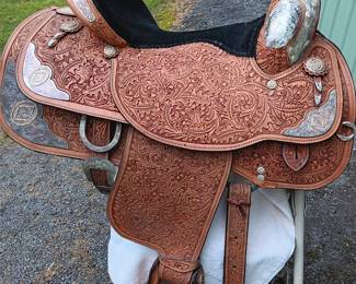 Handmade saddle made by Circle Y of Yoakum, Inc in Yoakum, Texas with silver-tone detail, 17" seat