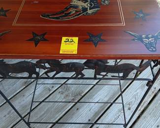 Lot #22 table with wood top with Cowboy Boot design and metal base with horses