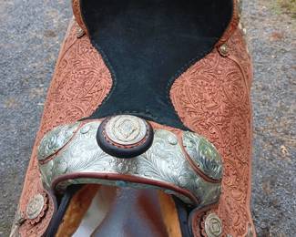 Handmade saddle made by Circle Y of Yoakum, Inc in Yoakum, Texas with silver-tone detail, 17" seat