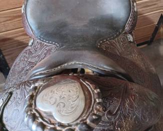 Billy Royal Western saddle with silver tone metal stirrups and hand tooled leather, 17" seat