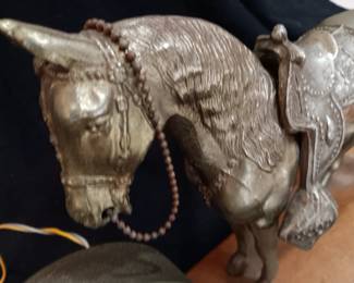 LOT #9: Brass clock with horse on wooden base.
No visible markings or signature. Base is 16" x 4 1/2". Horse is 11" tall. Weighs 8 pounds. The clock works.