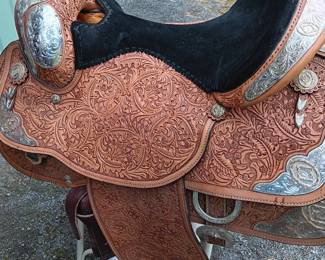 Handmade saddle made by Circle Y of Yoakum, Inc in Yoakum, Texas with silver-tone detail, 17" seat