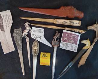 Lot 12: lot of 9 letter openers, some pewter, hand-carved wood