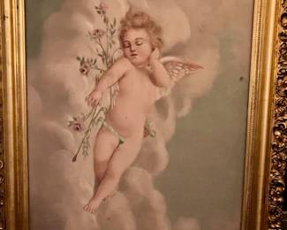 very large cherub in gilded frame