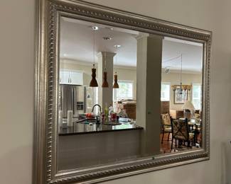 large silver framed beveled mirror