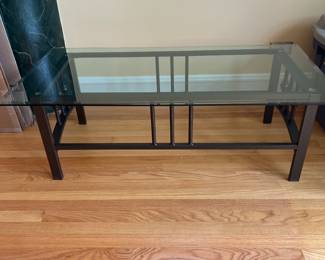 Metal based table with glass top