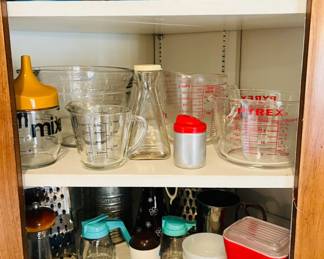 Vintage blue Pyrex bowls, vintage red Pyrex refrigerator canisters, Pyrex measuring glass, vintage kitchenware