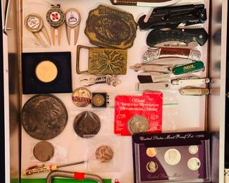 Silver coins, vintage Santa Claus light bulb, pocket knives, vintage belt buckles, bracelets