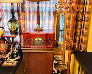 Antique sheet music cabinet, wooden coat rack, vintage framed mirrors, vintage standing ashtray, vintage table lamps