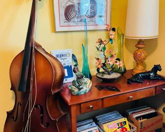 Vintage vinyl records, swung vases, ceramic panther, King Mortone Upright Bass, Juan Damaso artwork, People’s Beer advertising