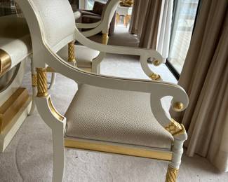 Custom modern design gold and opaque white dining room table with glass center. Comes with 6 chairs and 2 leaves to extend to 112 inches long! Chairs are very comfortable with rolled backs and gold accents. Stunning statement furniture. Table is 76 inches by 44 without leaves, each leaf is 18 inches wide.
Chairs are 3 ft high, 22 inches wide and seat height 19 inches.