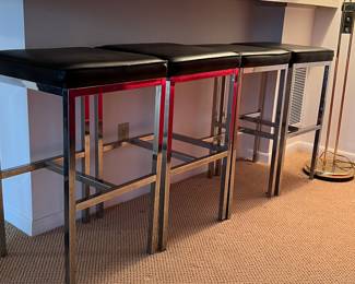 Set of 4 vintage bar stools with chrome legs and black leather seats. 18 square and 30 tall