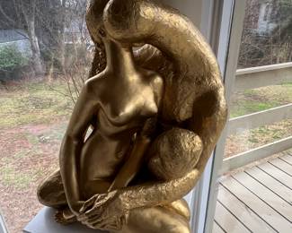 "The Embrace" a gold patina sculpture by Austin Productions, replicated from Rodins "The Lovers". Measures 24 by 30.