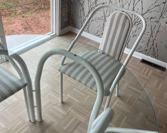 Munich round glass table set with 4 chairs. Table 42 inch round. Chairs, 34 high, 18 wide, seat height 18 inches.