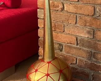 Gold uniquely shaped vase with red accents. 25.5 high, 13 across
