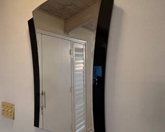 Art deco black and glass mirror. Measures 31 by 19.5