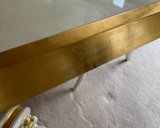 Custom modern design gold and opaque white dining room table with glass center. Comes with 6 chairs and 2 leaves to extend to 112 inches long! Chairs are very comfortable with rolled backs and gold accents. Stunning statement furniture. Table is 76 inches by 44 without leaves, each leaf is 18 inches wide.
Chairs are 3 ft high, 22 inches wide and seat height 19 inches.