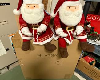 Here are a couple of great plush Santa Claus dressed in red velvet suits!